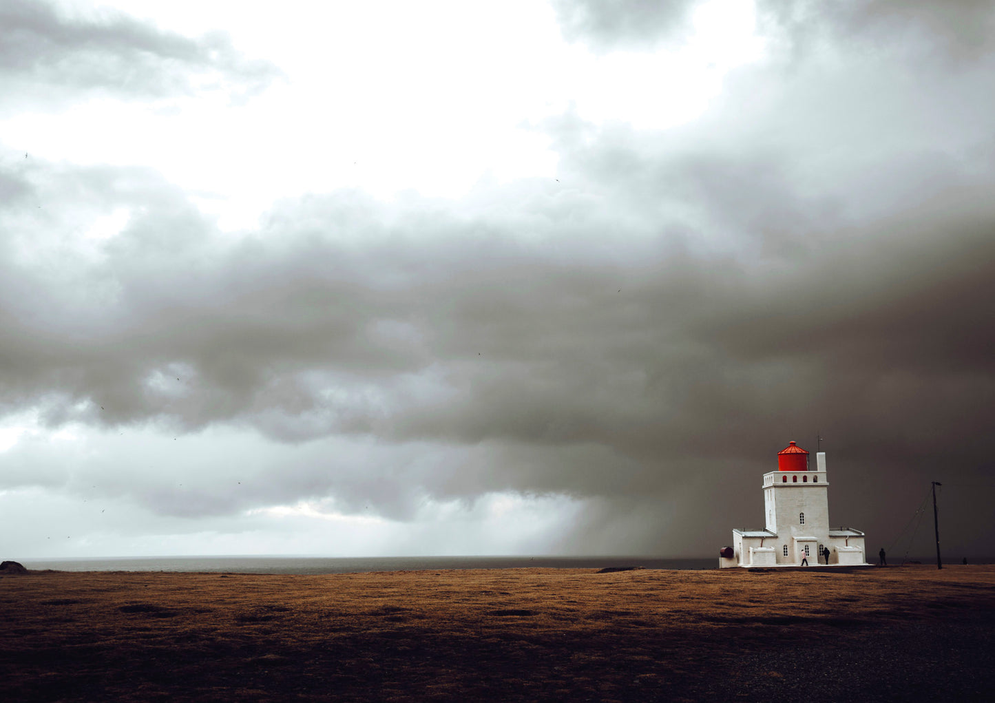 Mysterious lighthouse in Dyrholaey, Iceland  under dramatic stormy skies #18