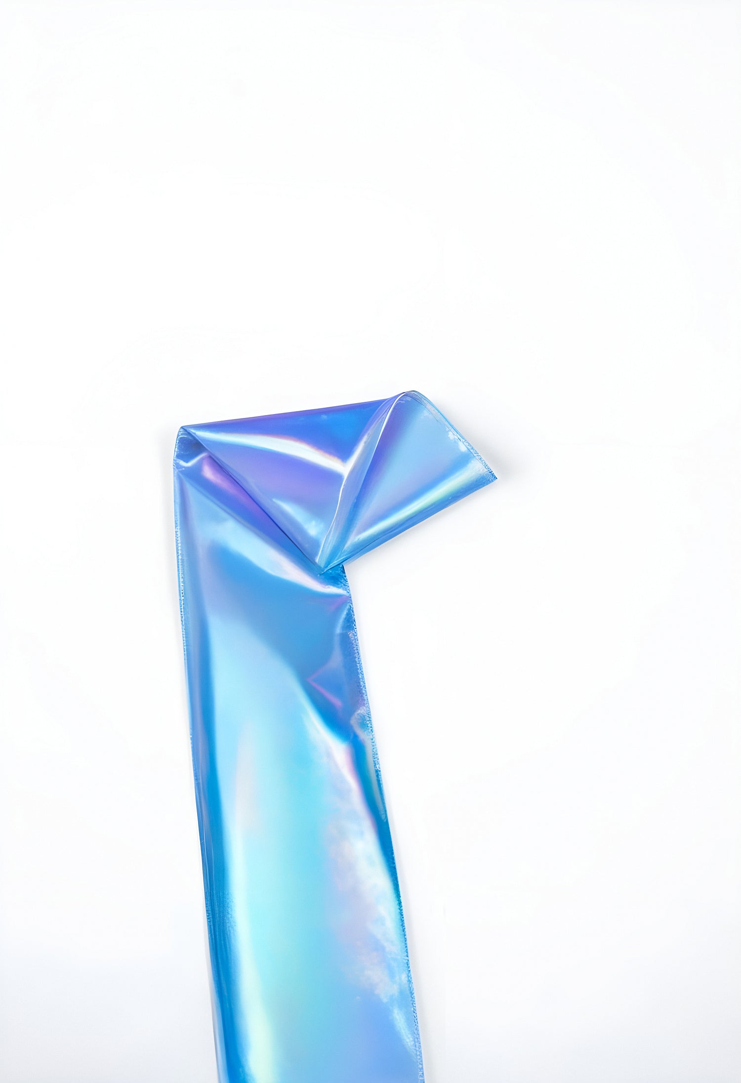 A shiny blue iridescent ribbon folded elegantly on a white background showcasing its vibrant colors and smooth texture