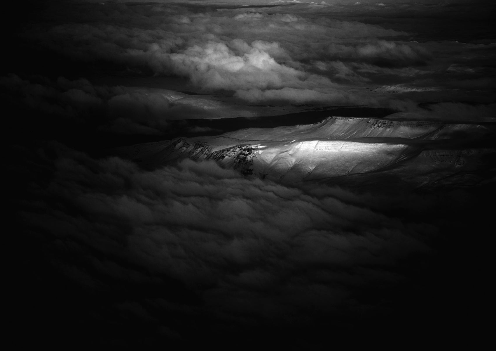 Dramatic light highlights a Norwegian mountain range #36