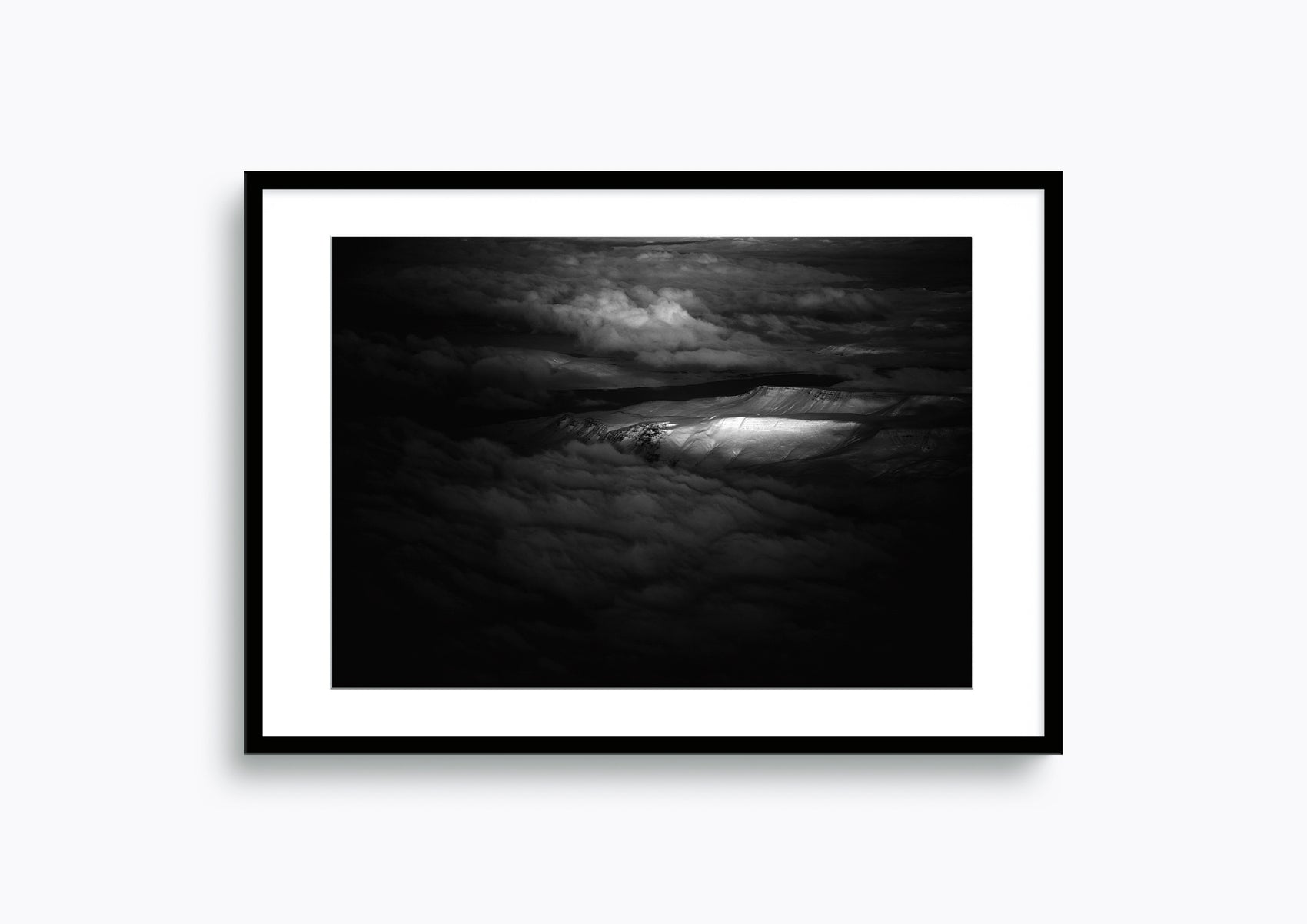 Dramatic light highlights a Norwegian mountain range #36