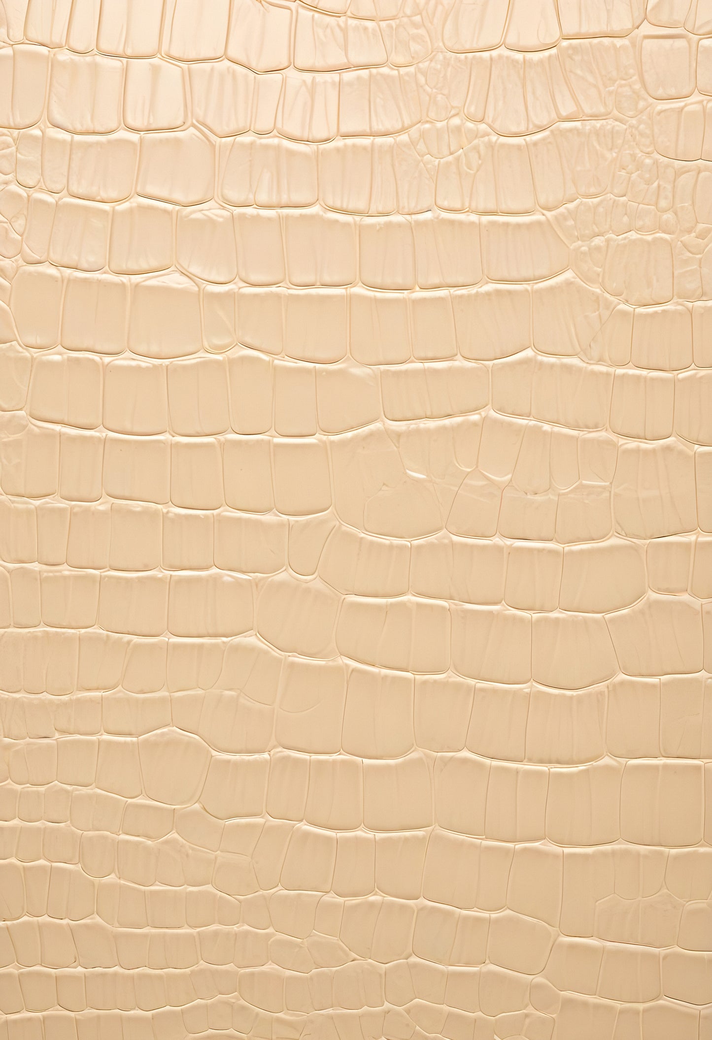 Textured beige alligator leather background showcasing unique patterns and details