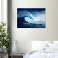 Print of a surfer inside a giant curling blue wave with white spray above a bed