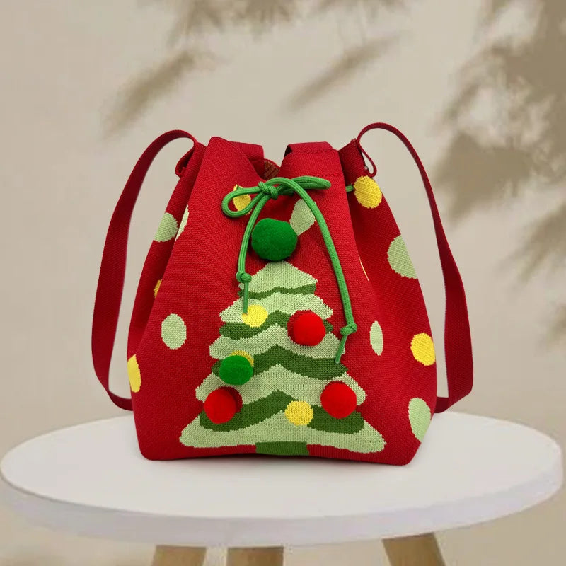 Red drawstring bag with Christmas tree design on a white surface