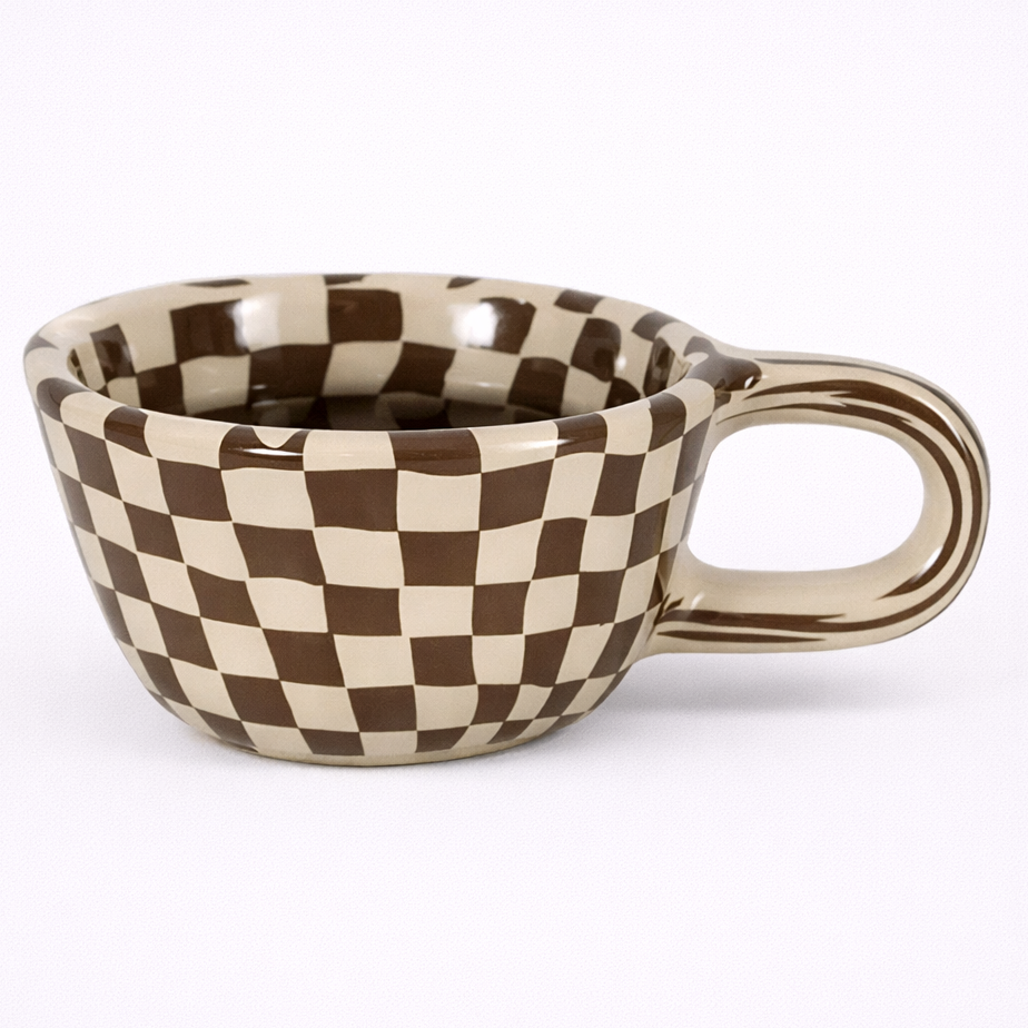 Checkered ceramic mug on a white background