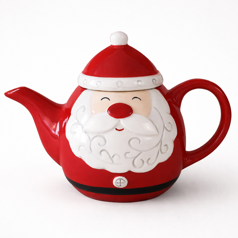 Red teapot shaped like Santa Claus on a white background