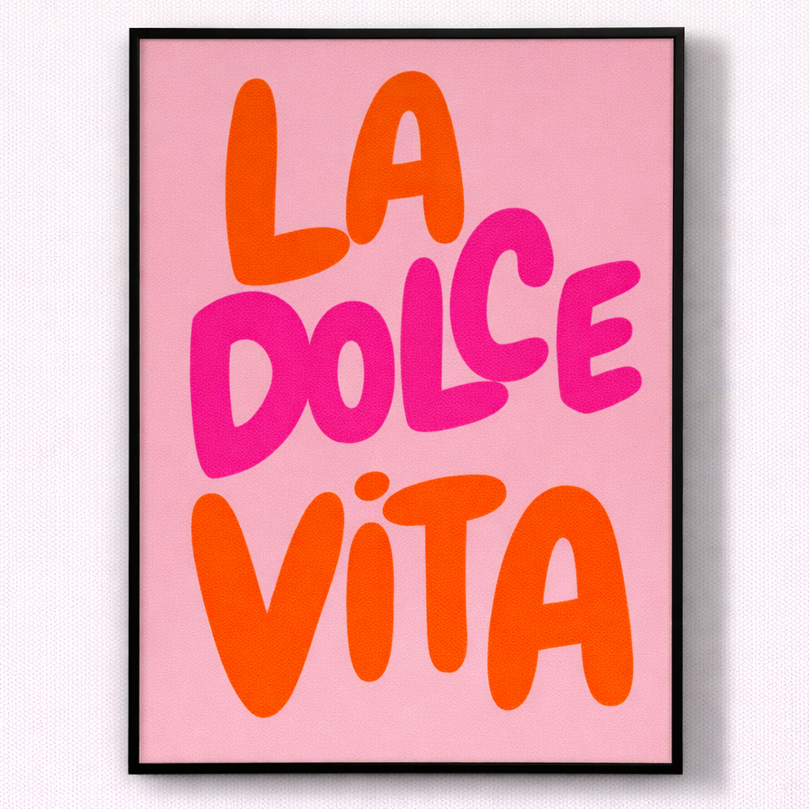 Framed poster with 'La Dolce Vita' text on a pink background