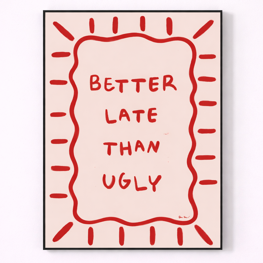 Framed artwork with 'Better Late Than Ugly' text on a light pink background