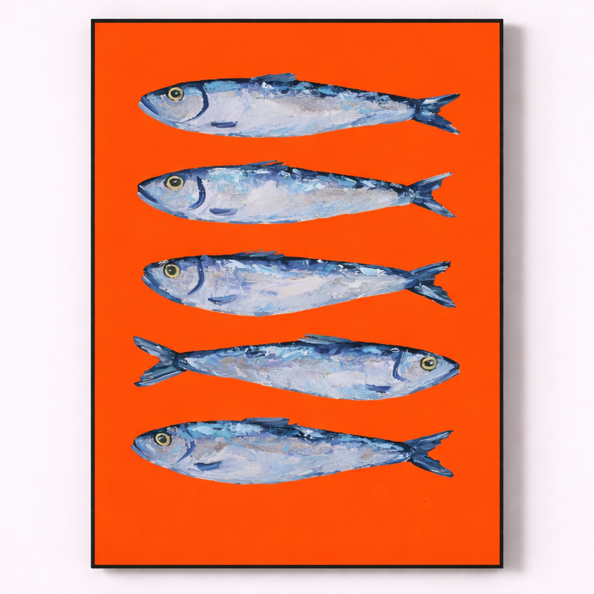 Framed artwork of four blue fish on an orange background