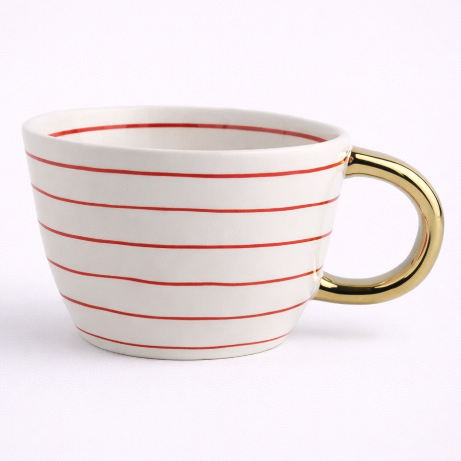 White mug with red stripes and a gold handle on a white background