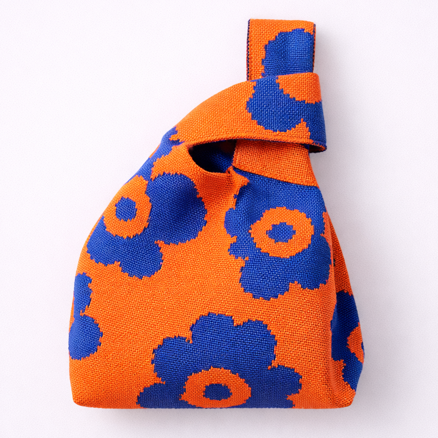 Orange and blue floral patterned bag on a white background