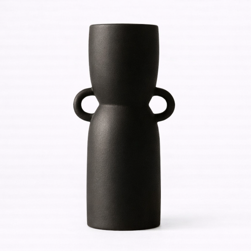 Black vase with two handles on a white background