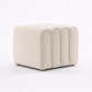 Beige ottoman with a modern design on a white background