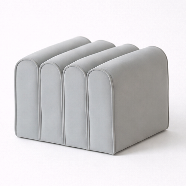 Gray ottoman with a curved design on a white background