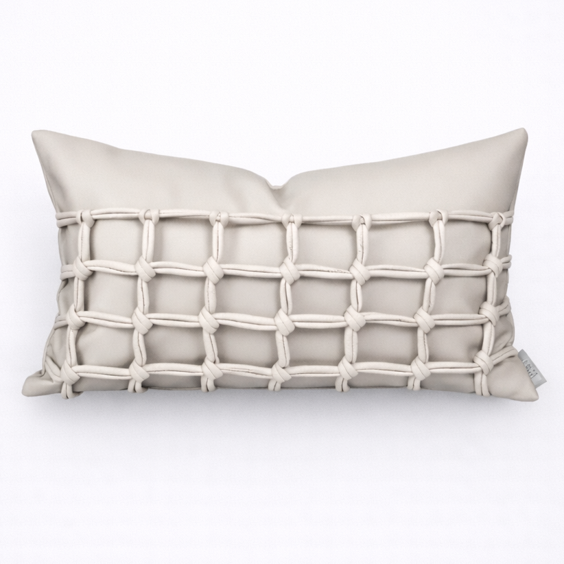 Beige pillow with a rope-like pattern on a white background