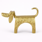 Gold dog-shaped object on a white background