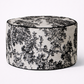 Decorative ottoman with floral pattern on a white background