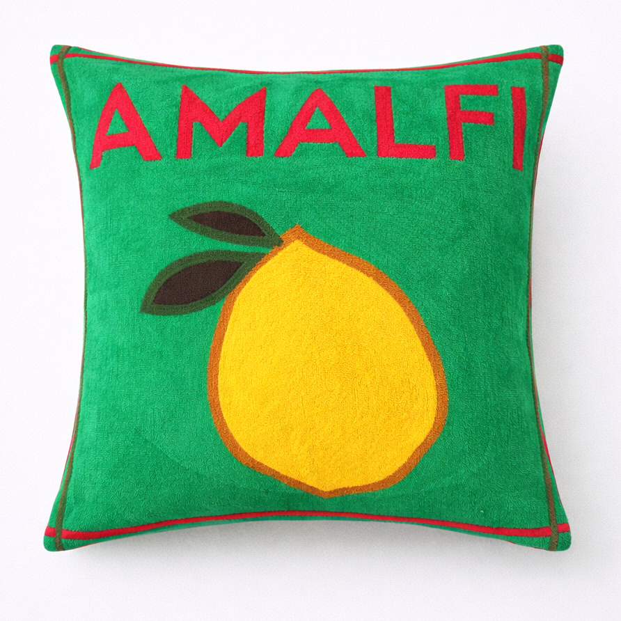 Green pillow with a lemon and 'AMALFI!' text