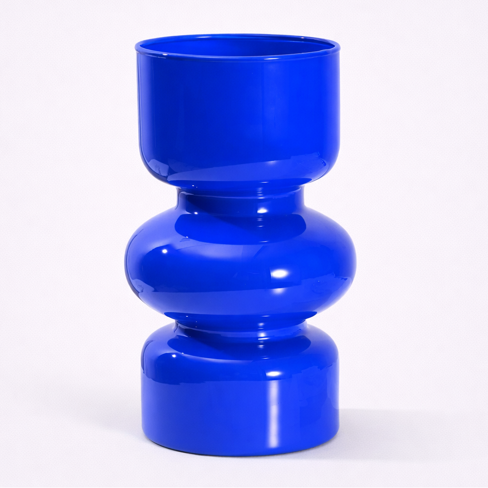 Blue vase with a cylindrical design on a white background