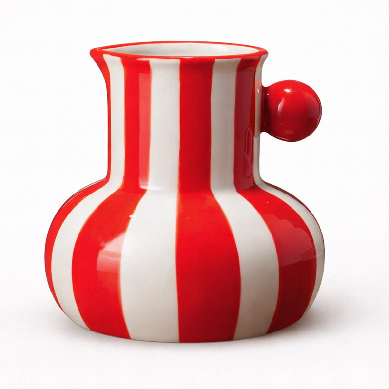 Red and white striped ceramic pitcher on a white background