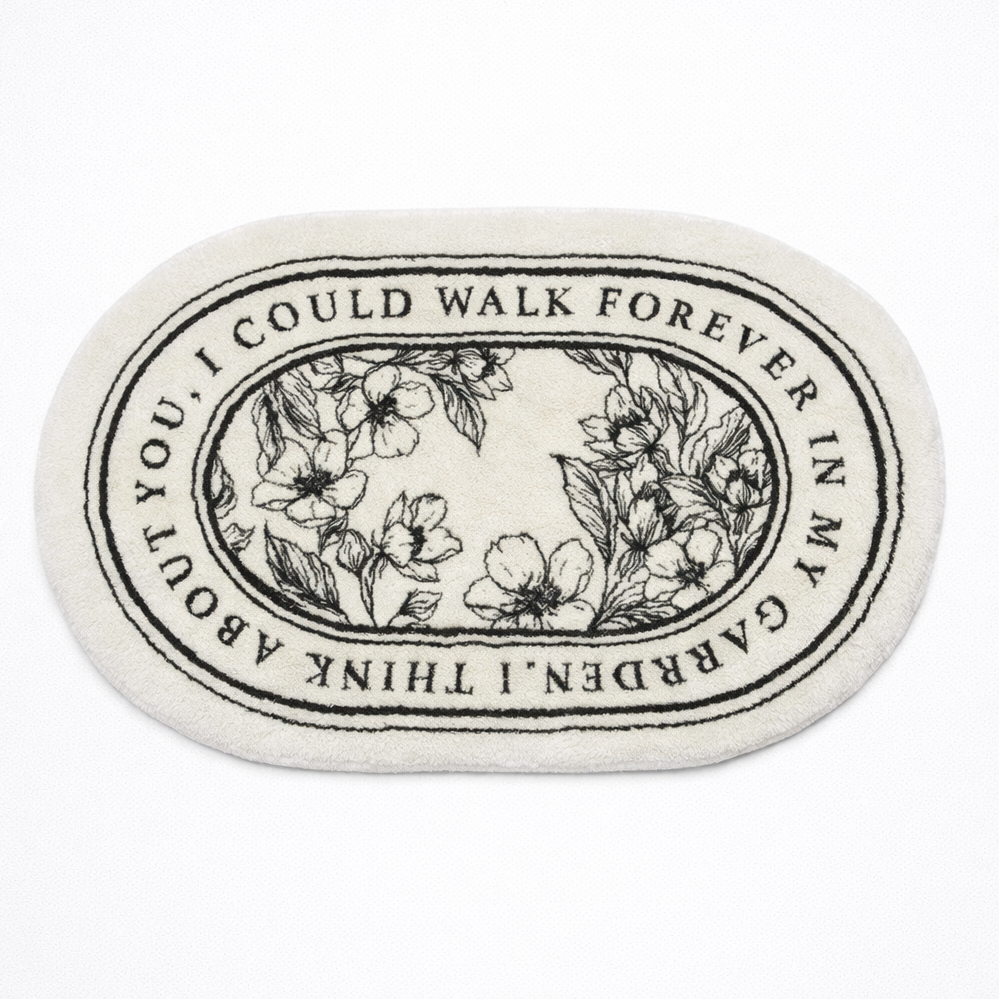 Round coaster with floral design and text on a white background