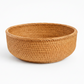 Woven brown basket on a white background