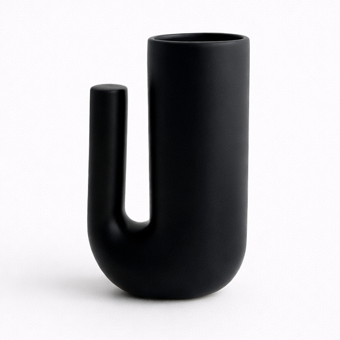 Black vase with unique design on a white background