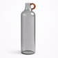 Clear glass bottle with a brown handle on a white background