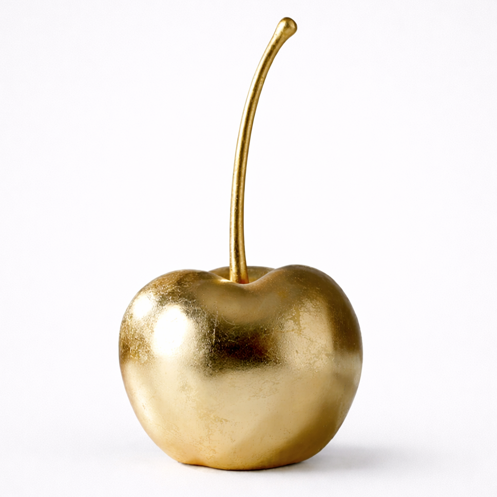 Gold cherry on a white background