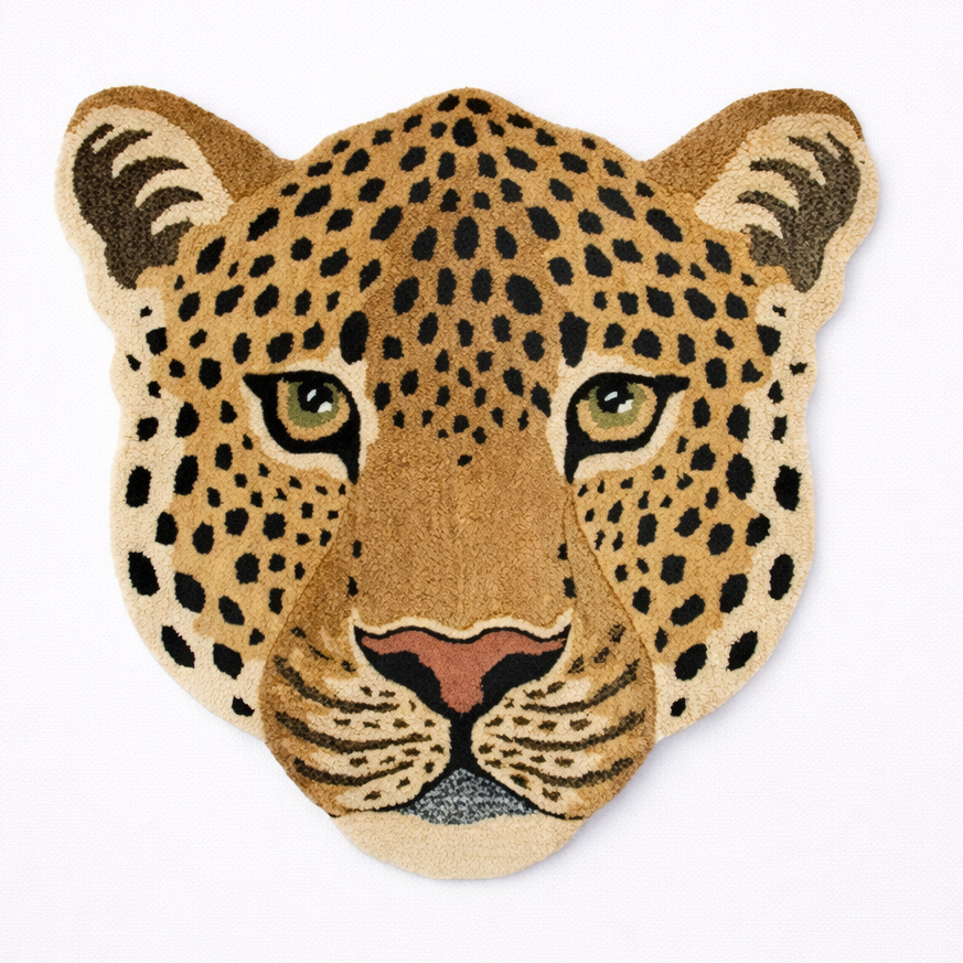 Leopard head-shaped rug on a white background