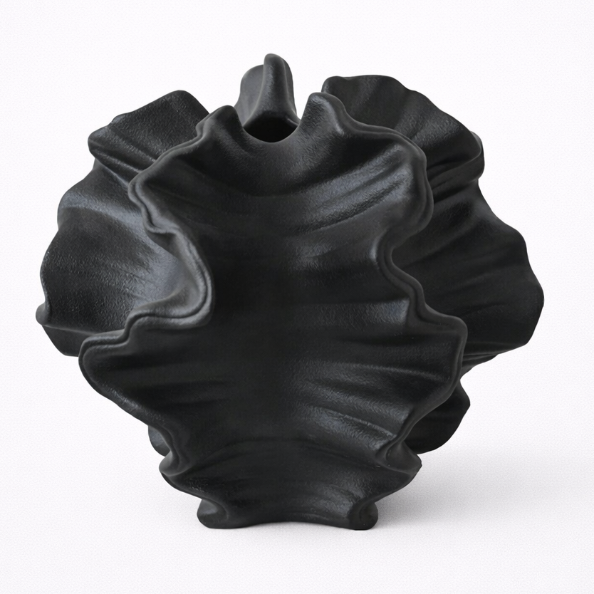 Black textured vase on a white background