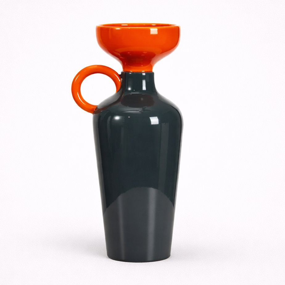 Dark gray carafe with an orange funnel and handle on a white background