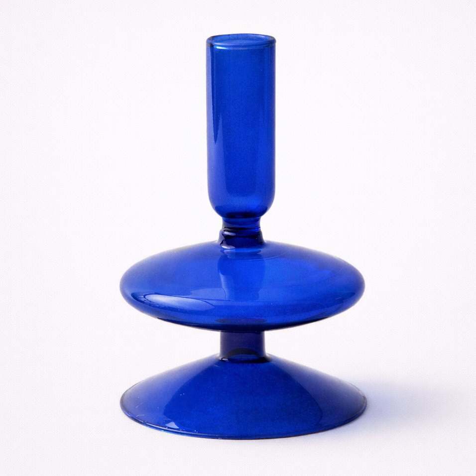 Blue glass object with measurements on a white background