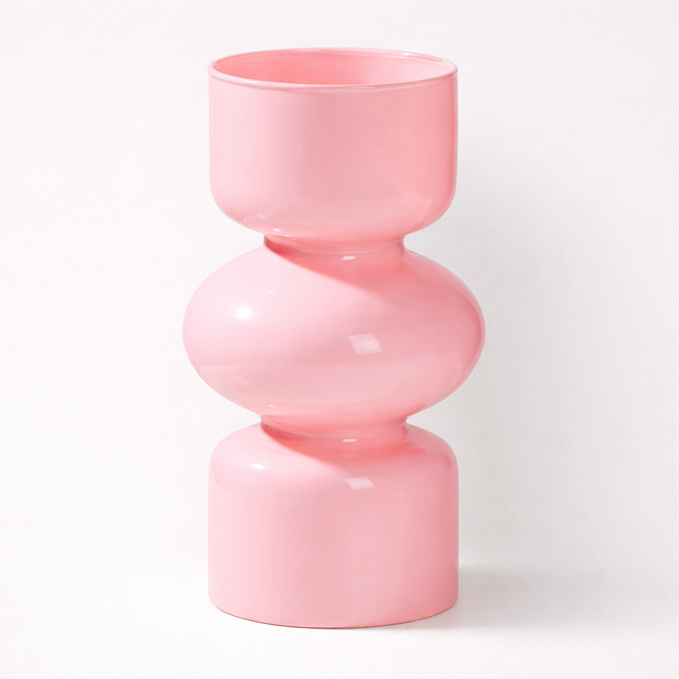 Pink cylindrical vase on a white background