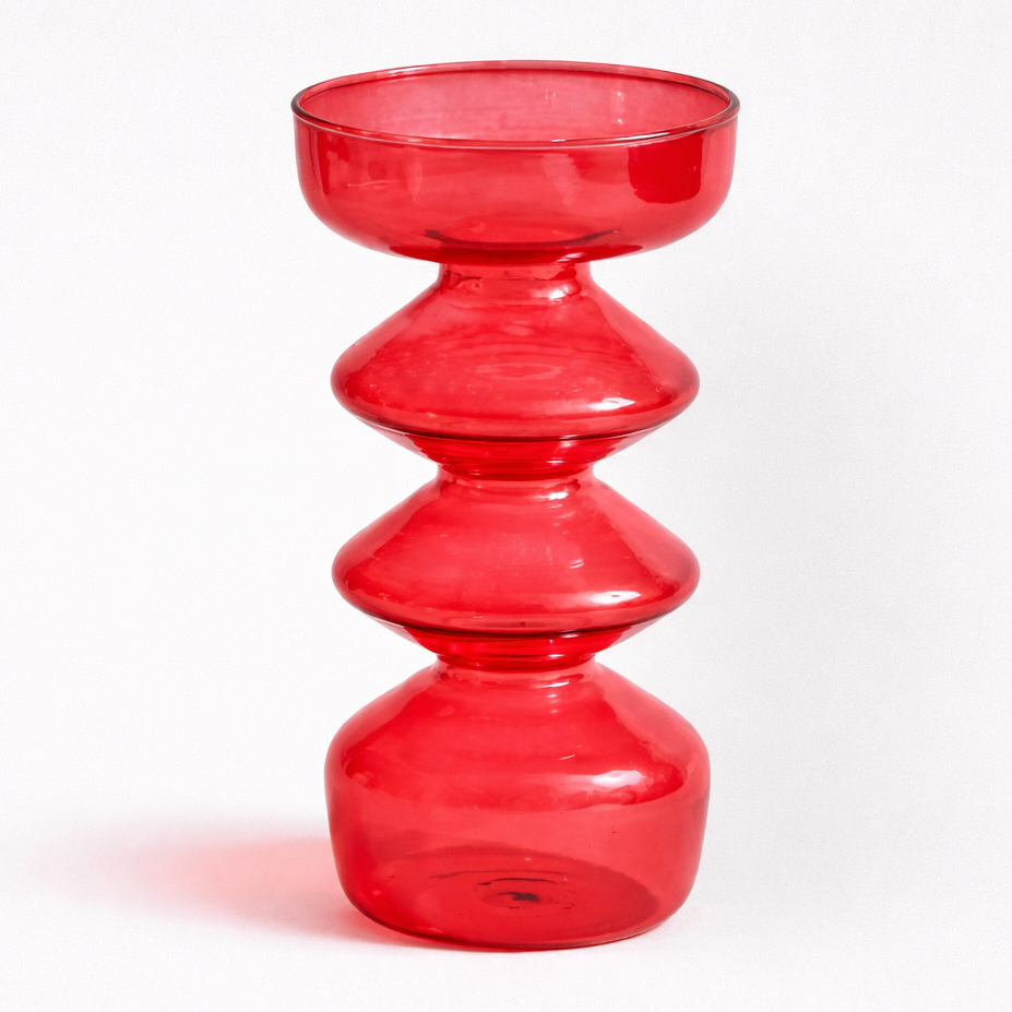 Red glass candle holder on a white background