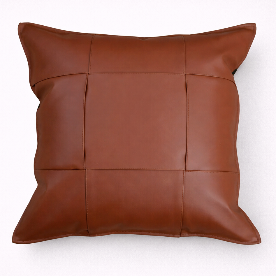 Brown leather pillow on a white background