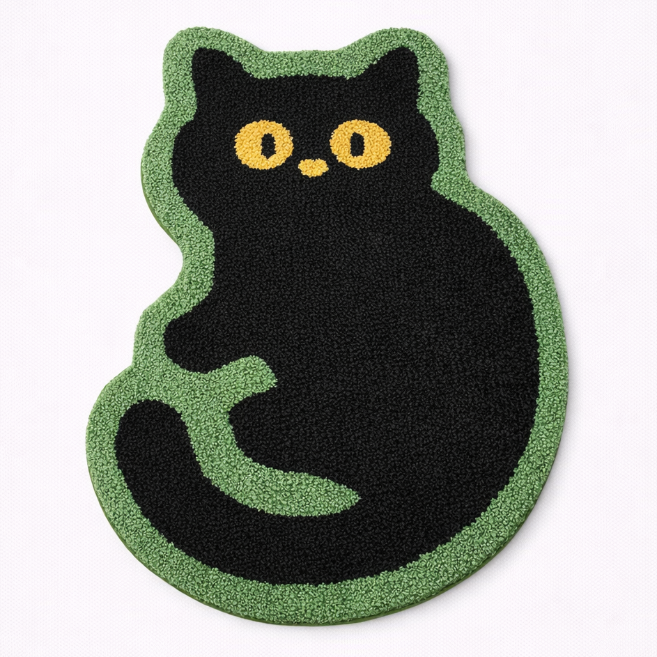 Black cat-shaped rug with green border on a white background