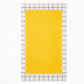 Yellow scalloped placemat on a white background