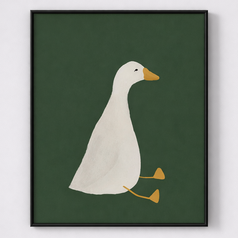 Framed artwork of a white duck with a yellow beak and feet on a green background.