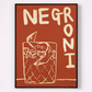 Framed artwork with 'NEGRONI' text and a glass illustration on a red background