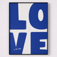 Framed artwork with 'LOVE is the key' text on a white background