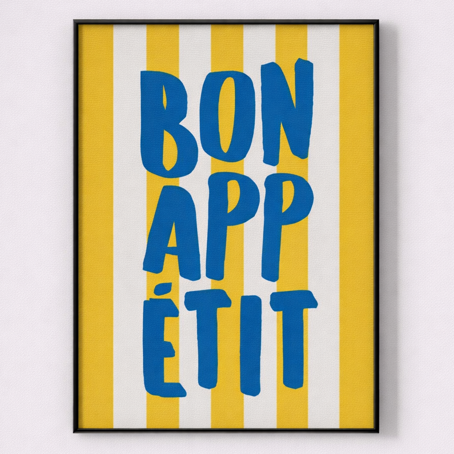 Framed artwork with 'Bon Appétit' text on a yellow and white striped background
