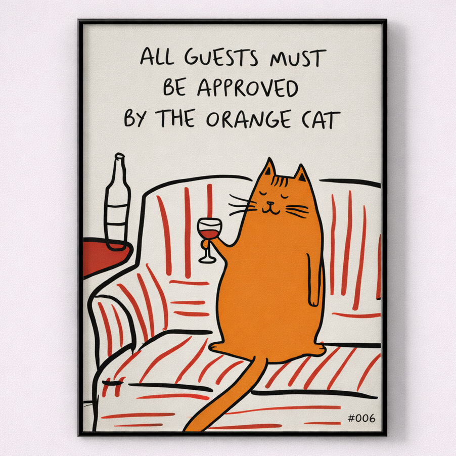 Framed artwork with an orange cat holding a glass of wine, sitting on a couch, and text 'All guests must be approved by the orange cat' on a white background.