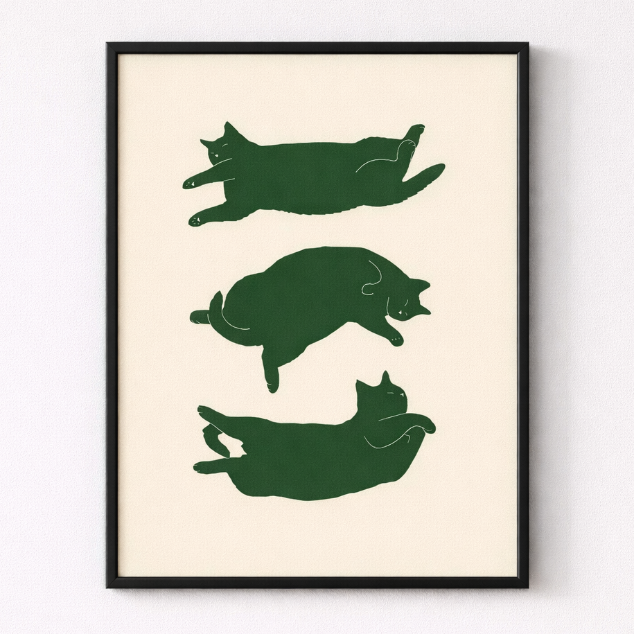 Framed artwork with green cat illustrations on a beige background