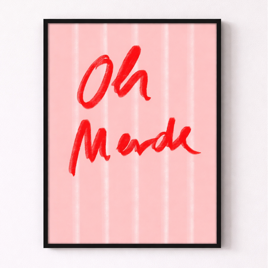 Framed artwork with 'Oh Merde' text on a pink background