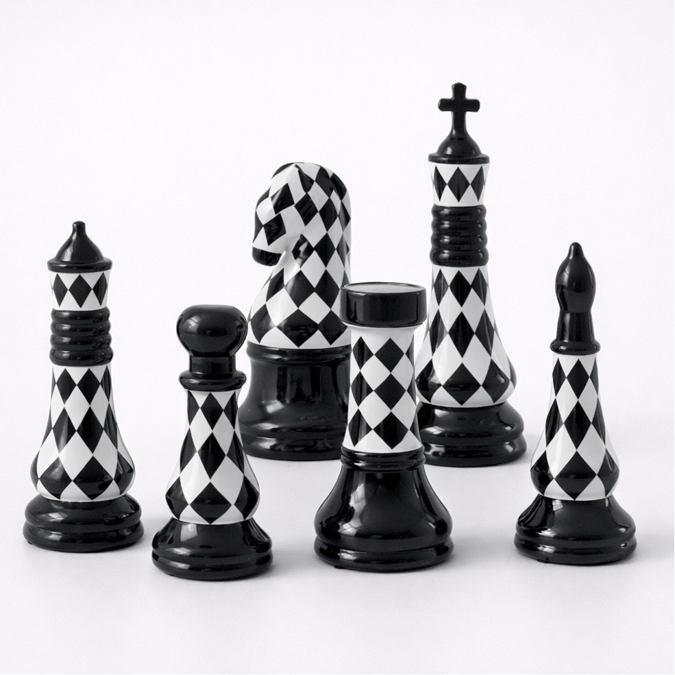 Set of black and white checkered chess pieces on a white background