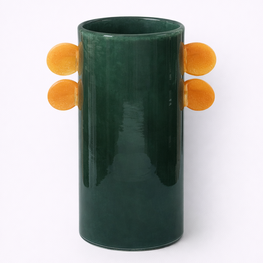 Green vase with orange circular handles on a white background