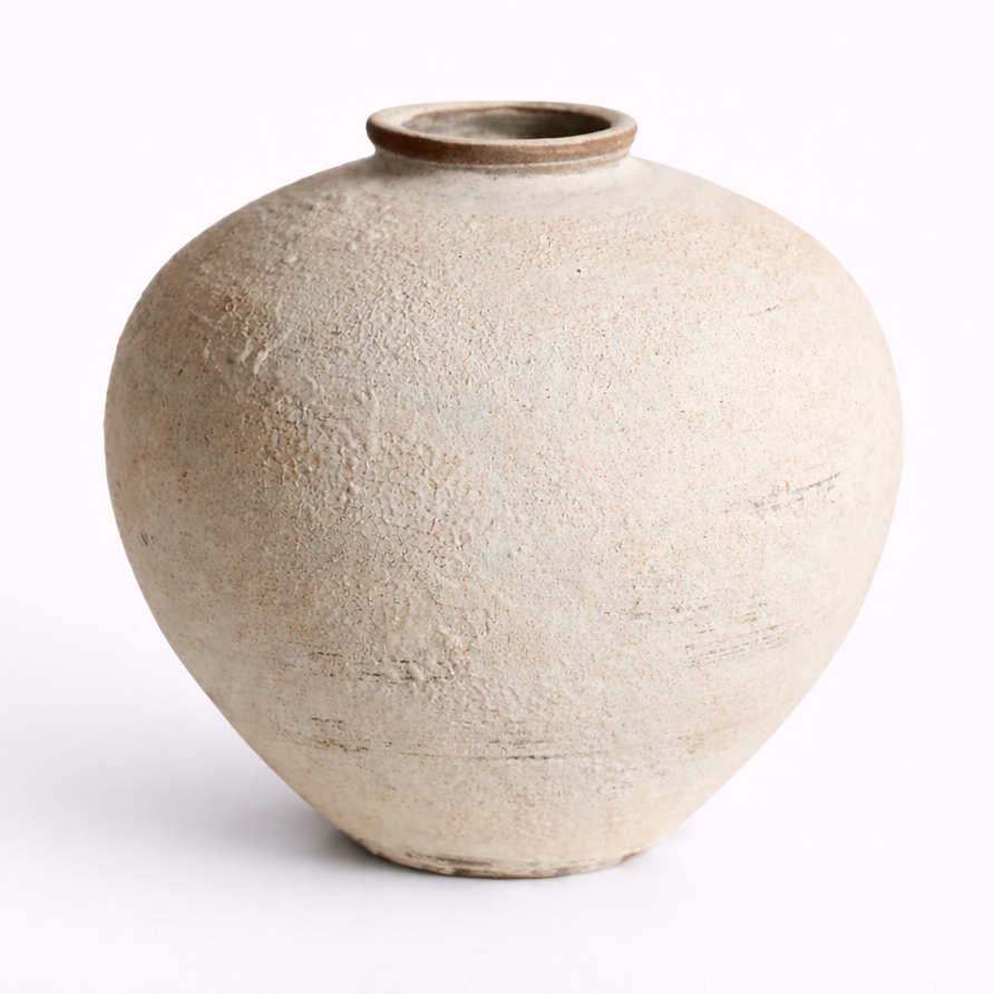 Beige ceramic vase on a white background
