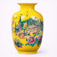 Yellow vase with peacock and floral design on a white background