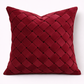 Red woven pillow on a white background