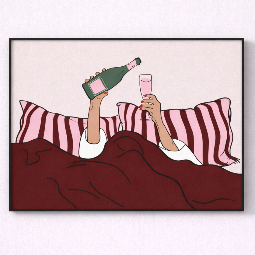 Framed artwork of two people in bed with a bottle and glass, on a white background